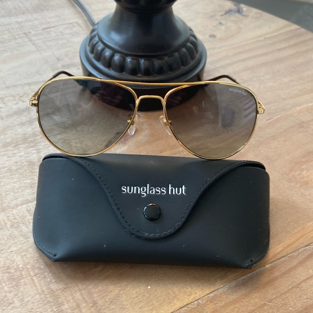 Sunglass hut Sunglass. Gold frames, see through, black lenses